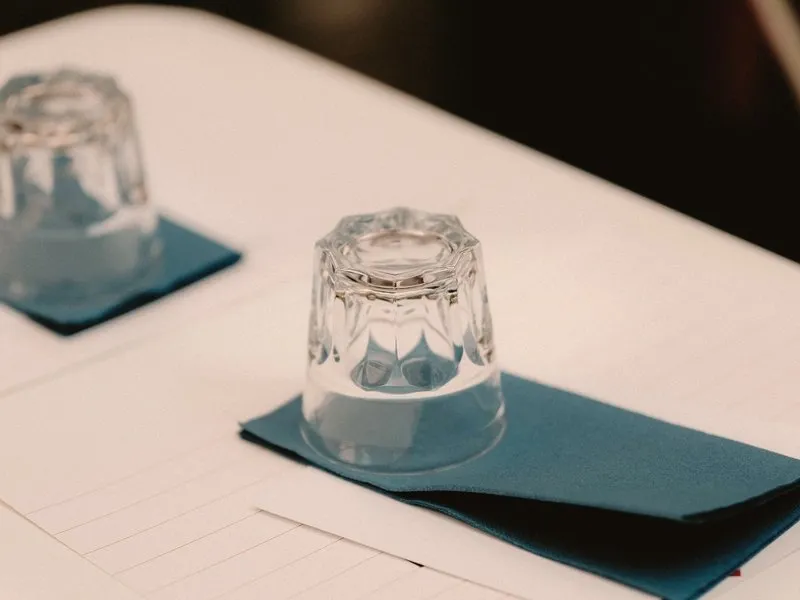 Upturned glasses on a white table